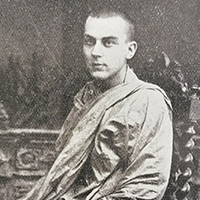 Photograph of Bhikkhu Ananda Metteyya sitting in a chair.